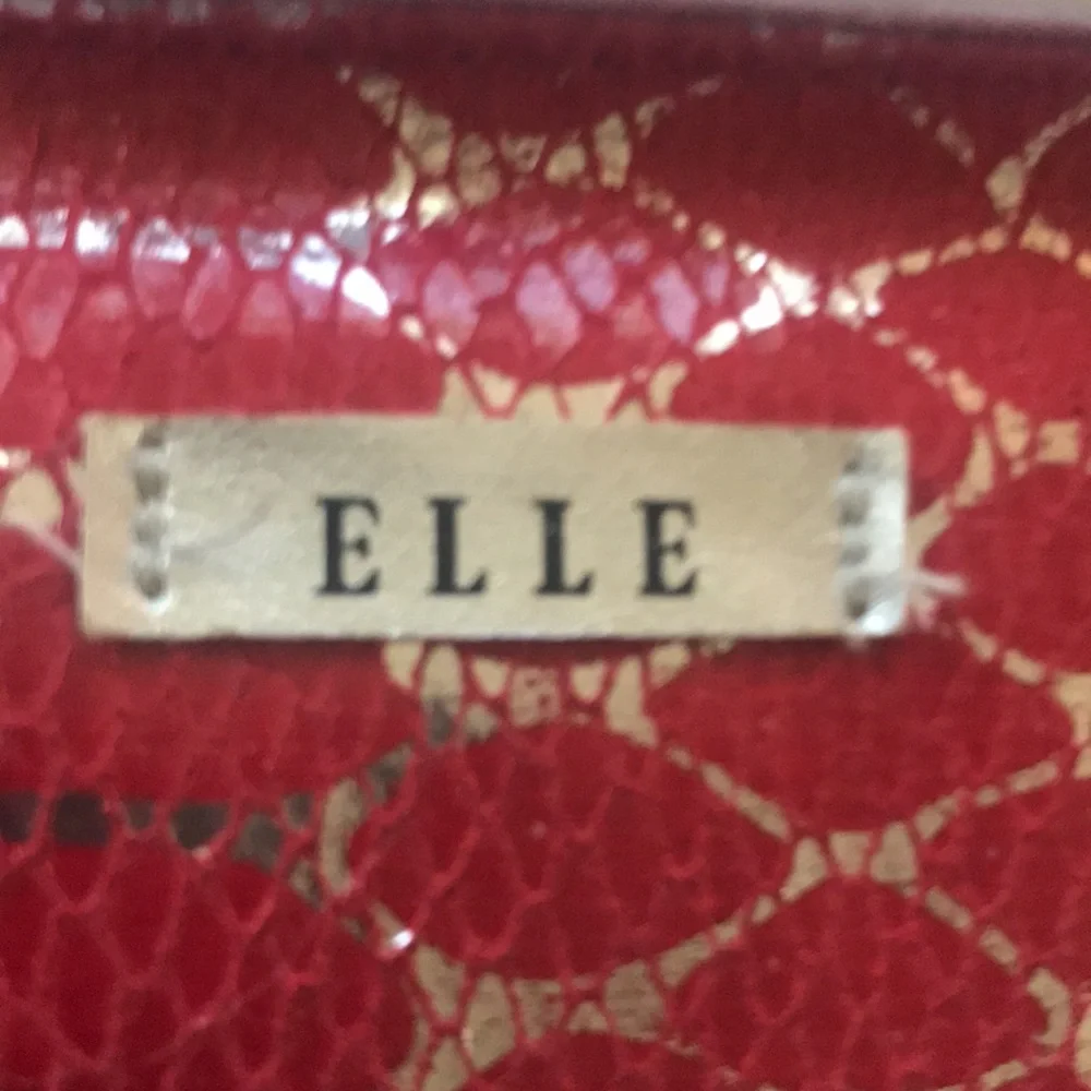ELLE Bold and stylish Red cosmetic bag featuring Silver Snakeskin pattern.
